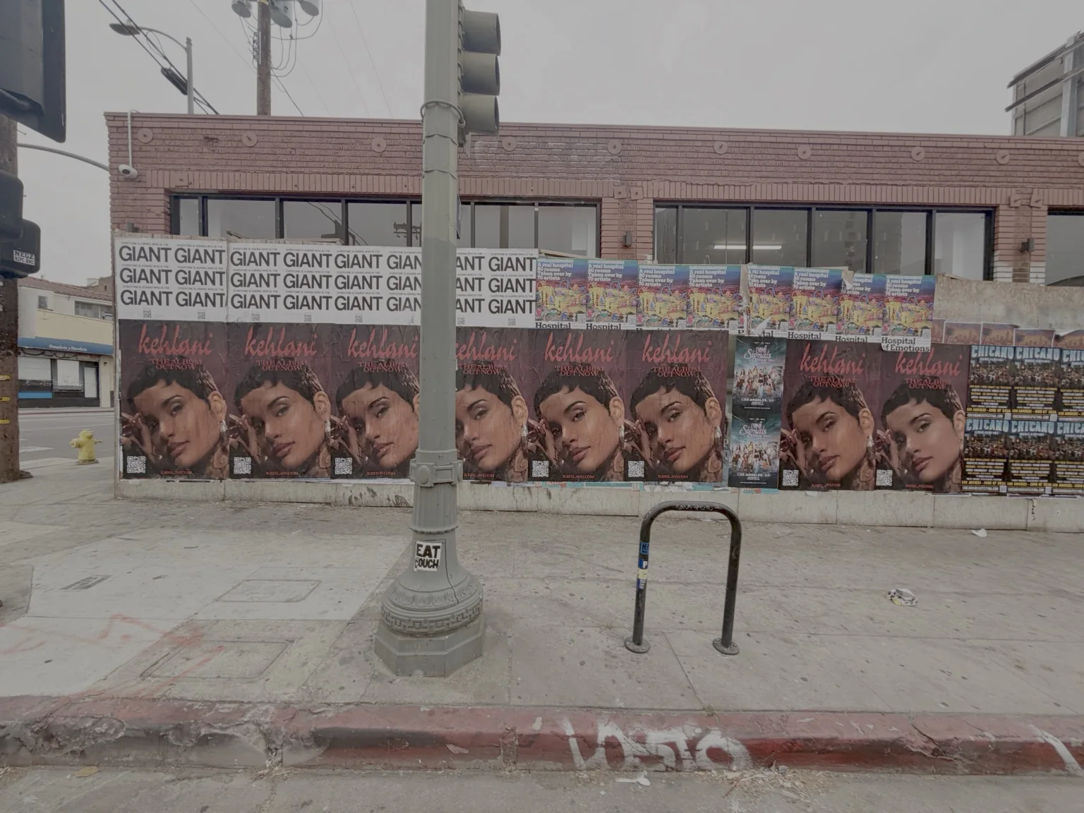 Street wall covered with a repeated music campaign