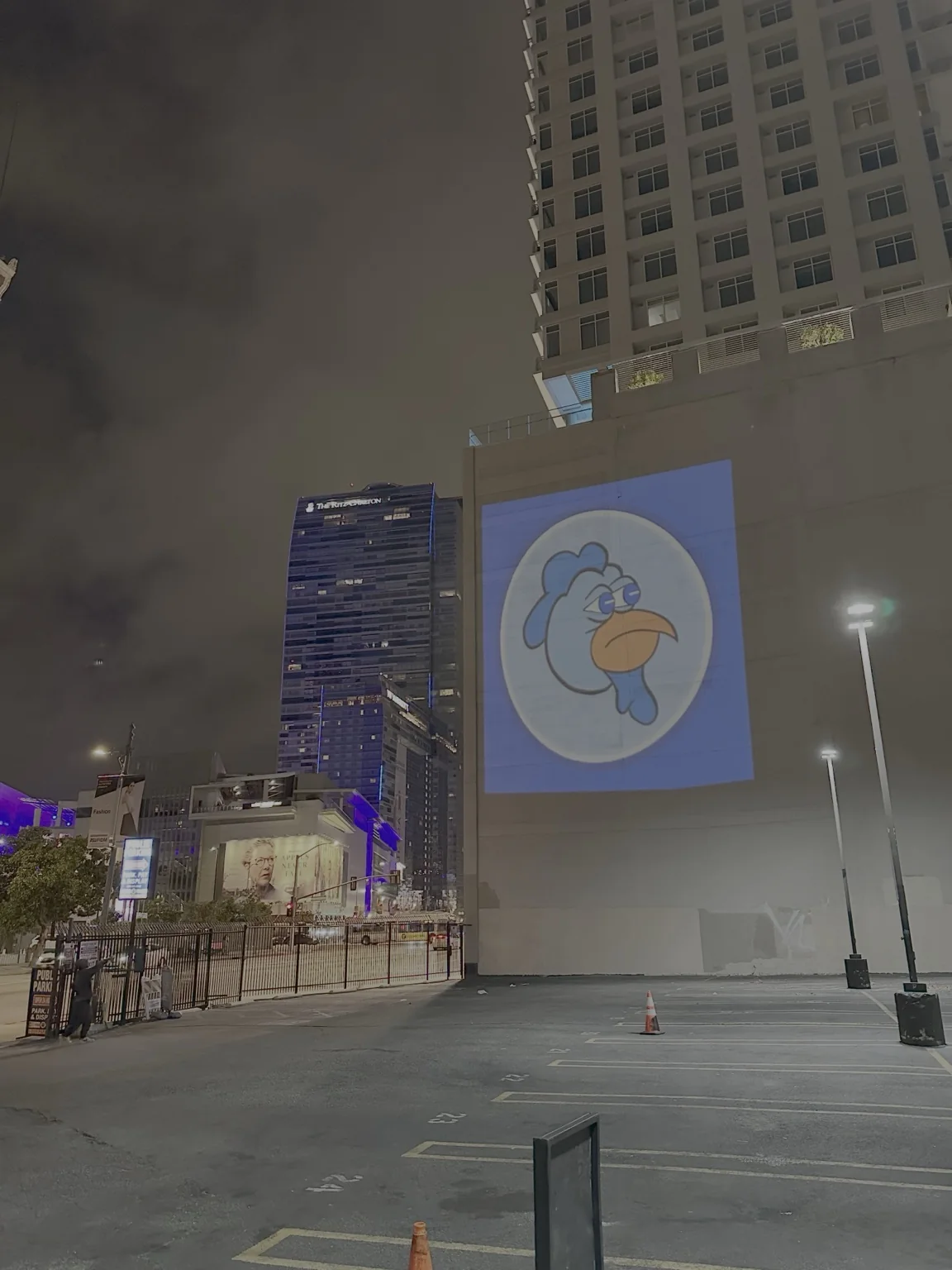 Large building projection in downtown Los Angeles at night